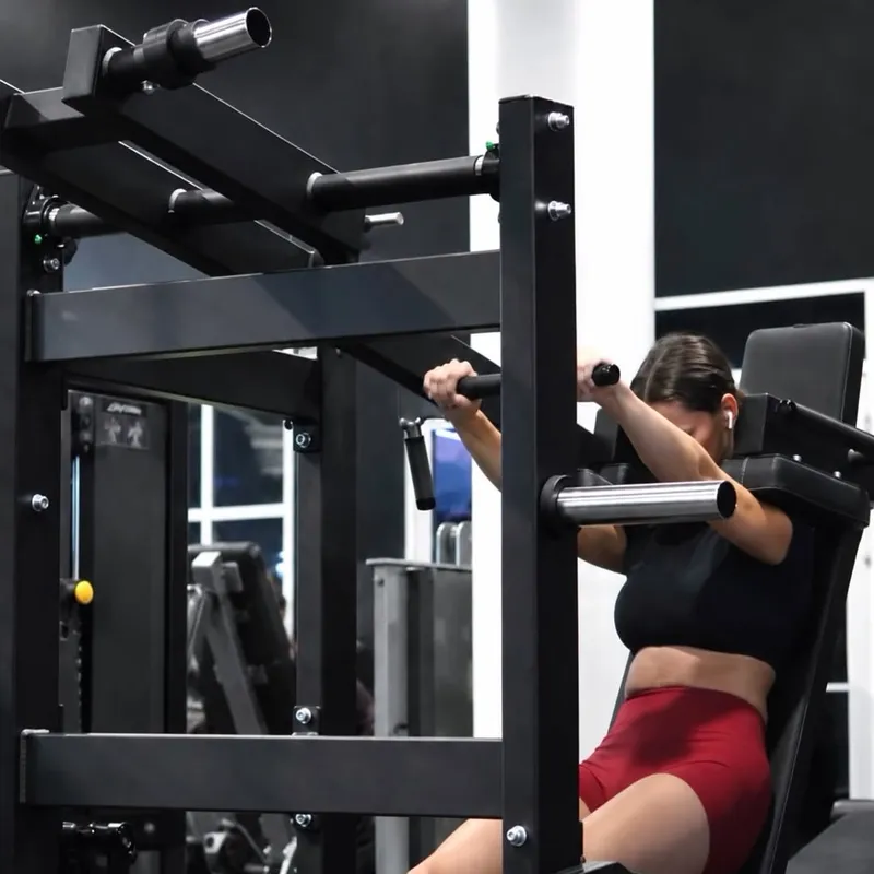 Member using new strength equipment at XCEL Athletic Lifestyle, a rooftop gym in Hoboken, NJ