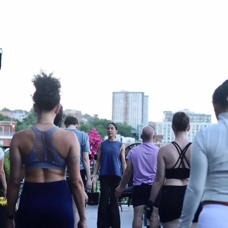 Members working out together on the roof at XCEL Athletic Lifestyle, a rooftop gym in Hoboken, NJ