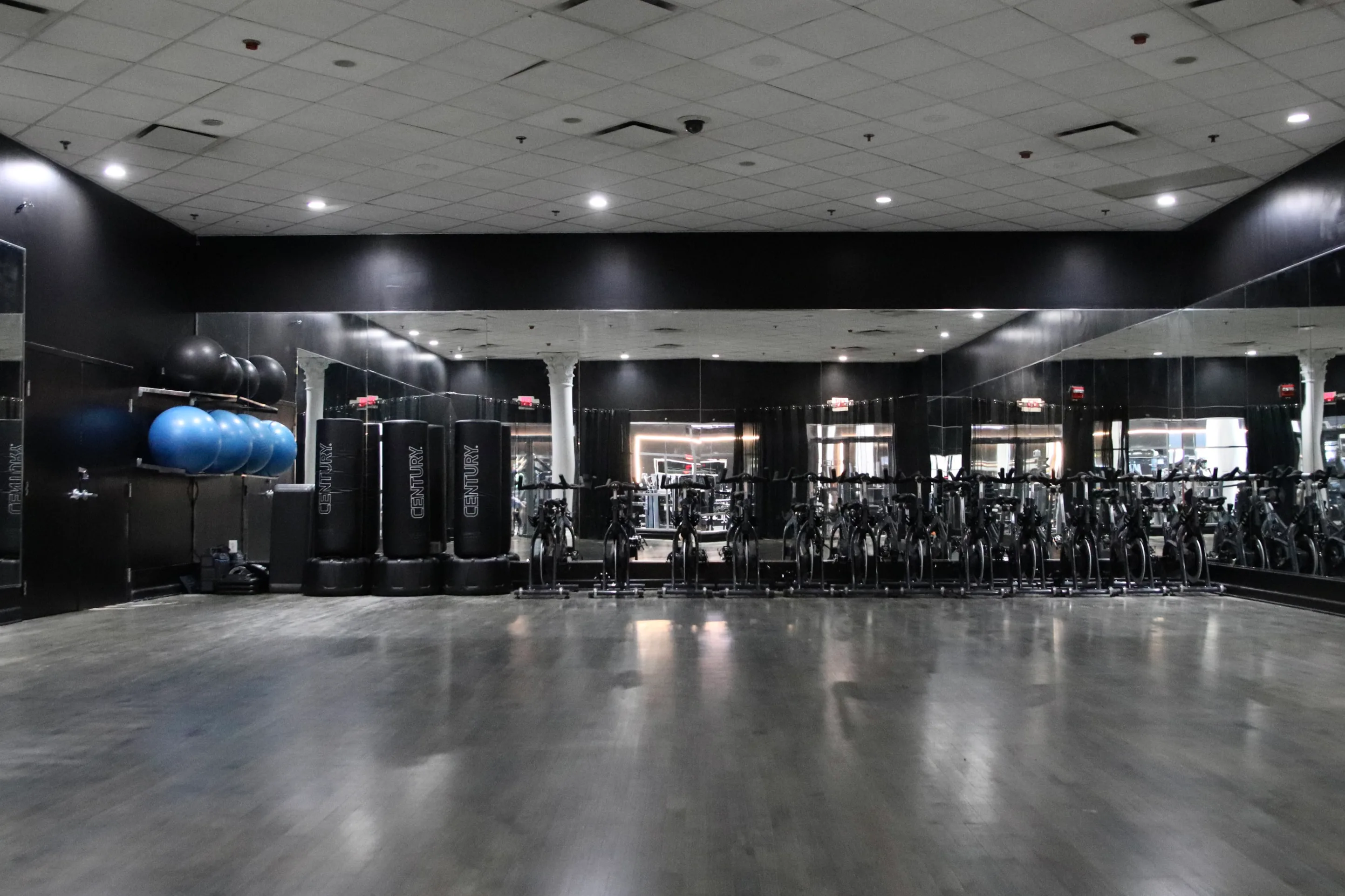 Group fitness studio with bikes and stability balls at XCEL Athletic Lifestyle, a rooftop gym in Hoboken, NJ